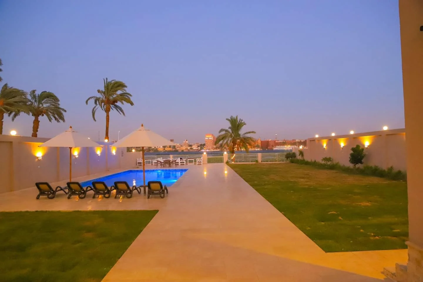 Shared pool and Nile-side garden at Royal Nile Villas